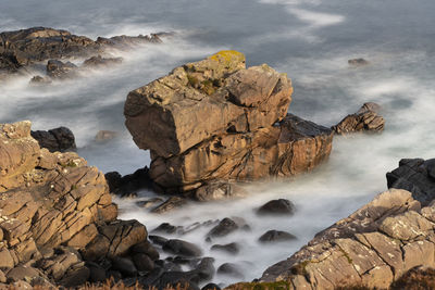 Scenic view of rocks in sea