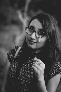 Portrait of young woman wearing eyeglasses