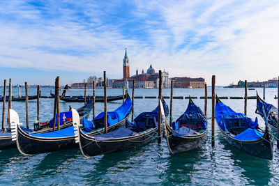 Boats moored in canal