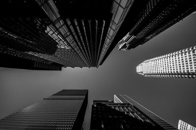 Low angle view of tall buildings against sky