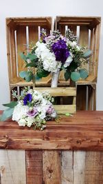 Flower vase on wooden table