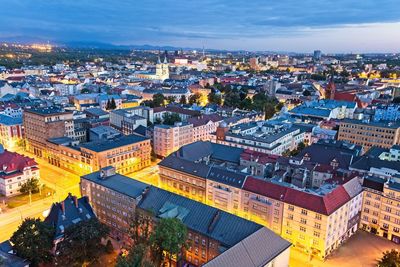 High angle view of illuminated buildings in city against sky