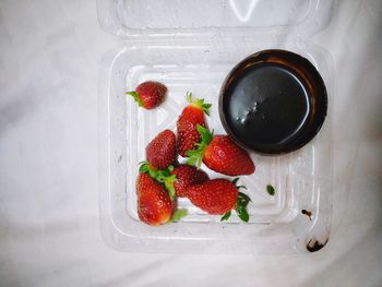 High angle view of strawberries in bowl on table