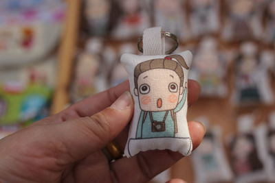 Close-up of person holding paper
