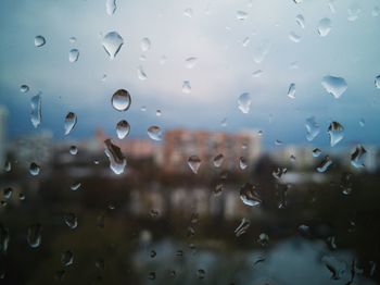 Full frame shot of raindrops on glass window