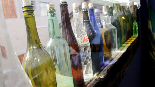 Close-up of bottles in glass