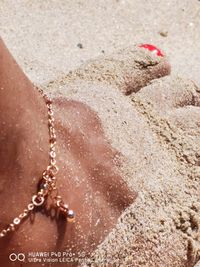 High angle view of woman on sand at beach