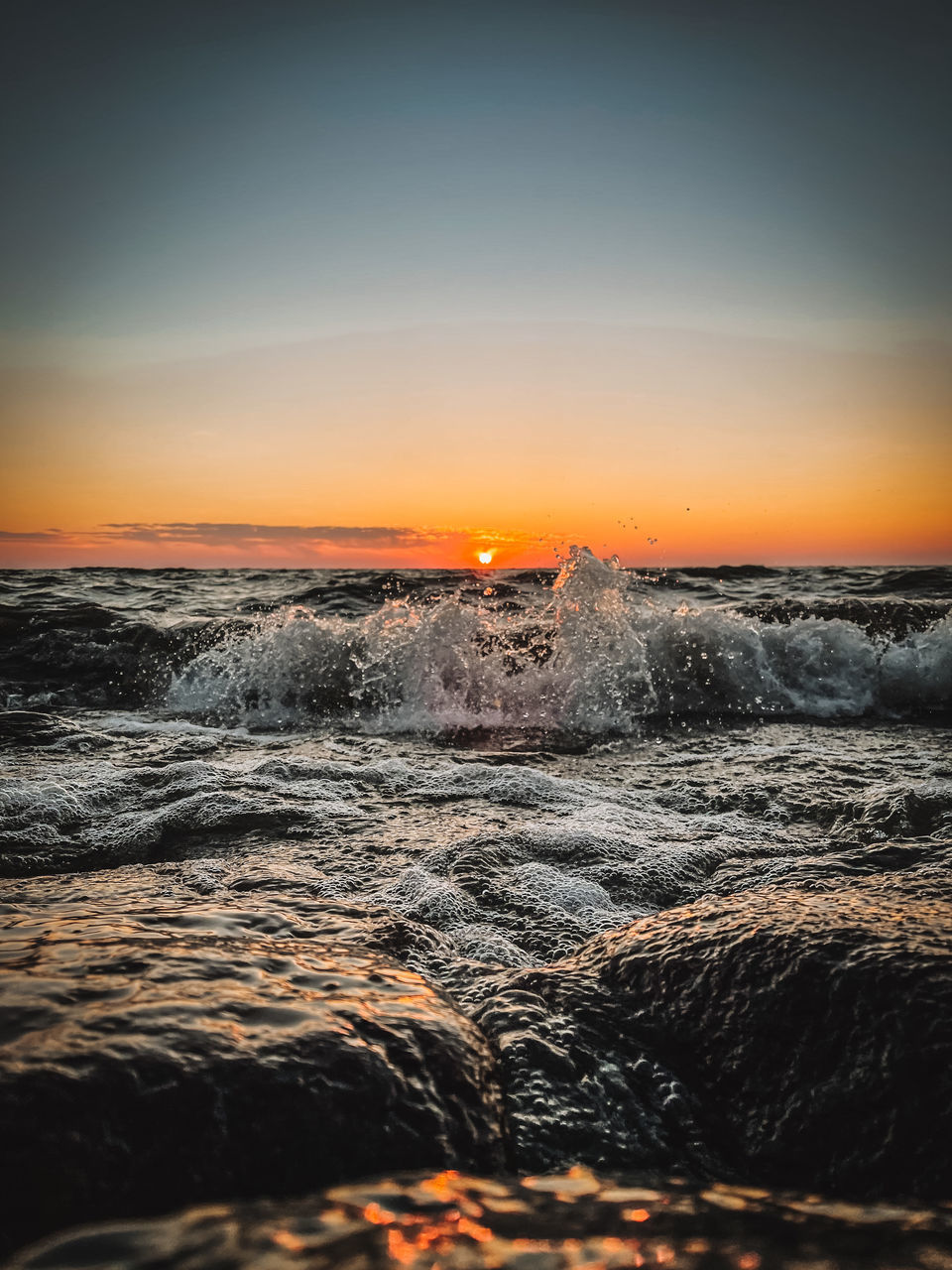 SCENIC VIEW OF SEA AT SUNSET