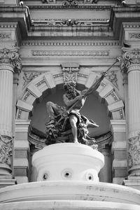 Low angle view of statue against building