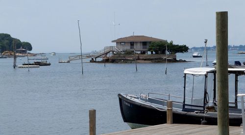 Boats moored at harbor