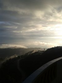 Scenic view of mountains against dramatic sky