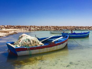 Boats moored in sea