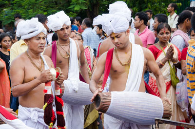 Group of people standing in market