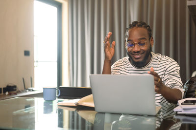 Young man using laptop at office