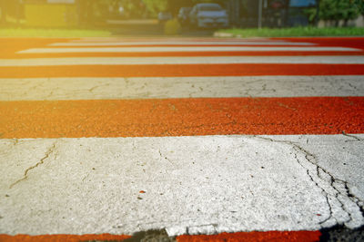 Close-up of zebra crossing on road