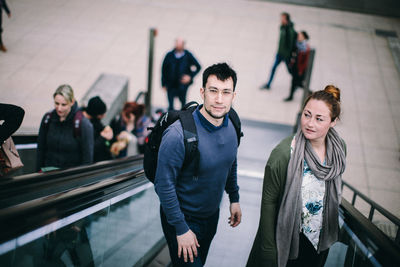 Group of people on escalator