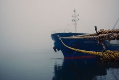 Sailboat on sea against clear sky