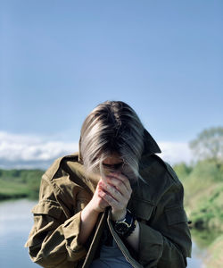 Portrait of woman against sky