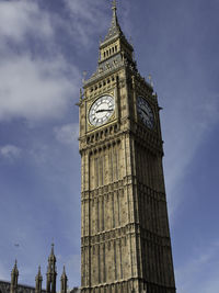 Low angle view of clock tower against sky