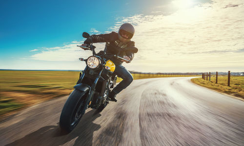 Man riding motorcycle on road