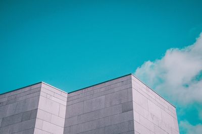 Low angle view of building against blue sky