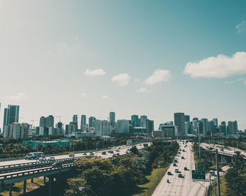 High angle view of buildings in city against sky