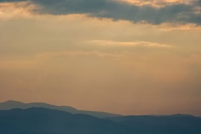 Scenic view of silhouette mountain against sky during sunset