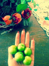 Close-up of hand holding fruits