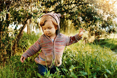 Cute girl standing on field