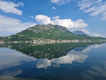 Scenic view of lake and mountains against sky