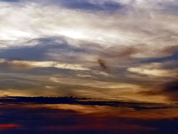 Low angle view of dramatic sky during sunset