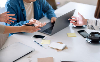 Business professionals discussing in creative office