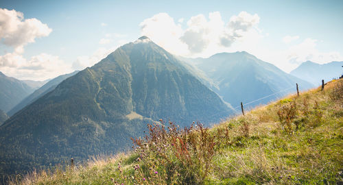 Panoramic view of land and mountains against sky