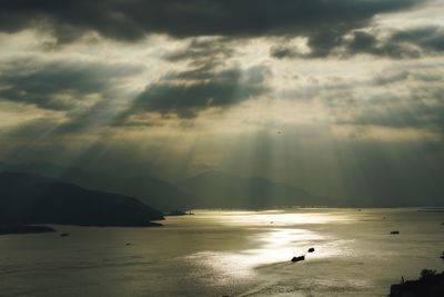 Scenic view of sea against cloudy sky