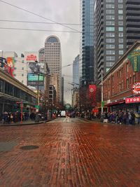 City street amidst buildings against sky