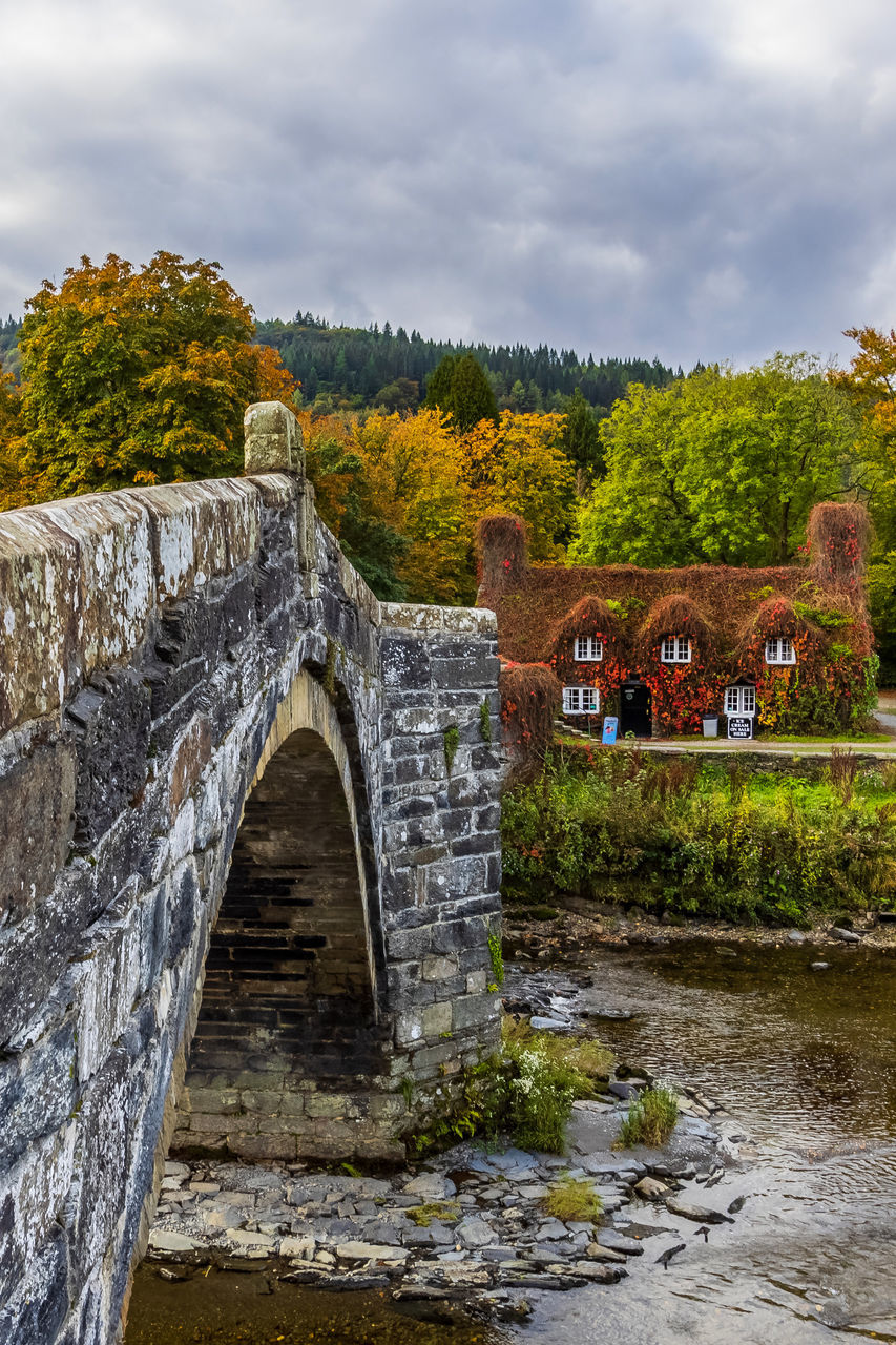architecture, built structure, water, bridge, river, nature, cloud, sky, plant, history, tree, waterway, the past, travel destinations, autumn, no people, reflection, building exterior, environment, travel, building, arch, rural area, outdoors, tourism, landscape, transportation, old, wall, arch bridge, day, ancient, city, stone material, ruins, rock