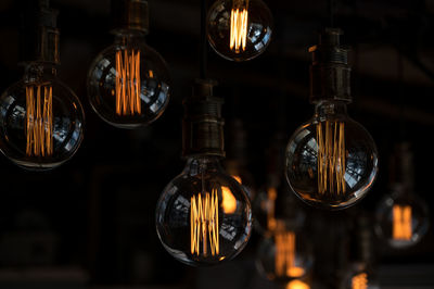 Close-up of illuminated light bulb in retro style