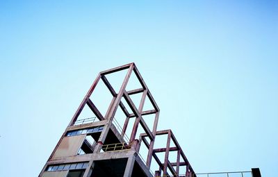 Low angle view of built structure against clear blue sky