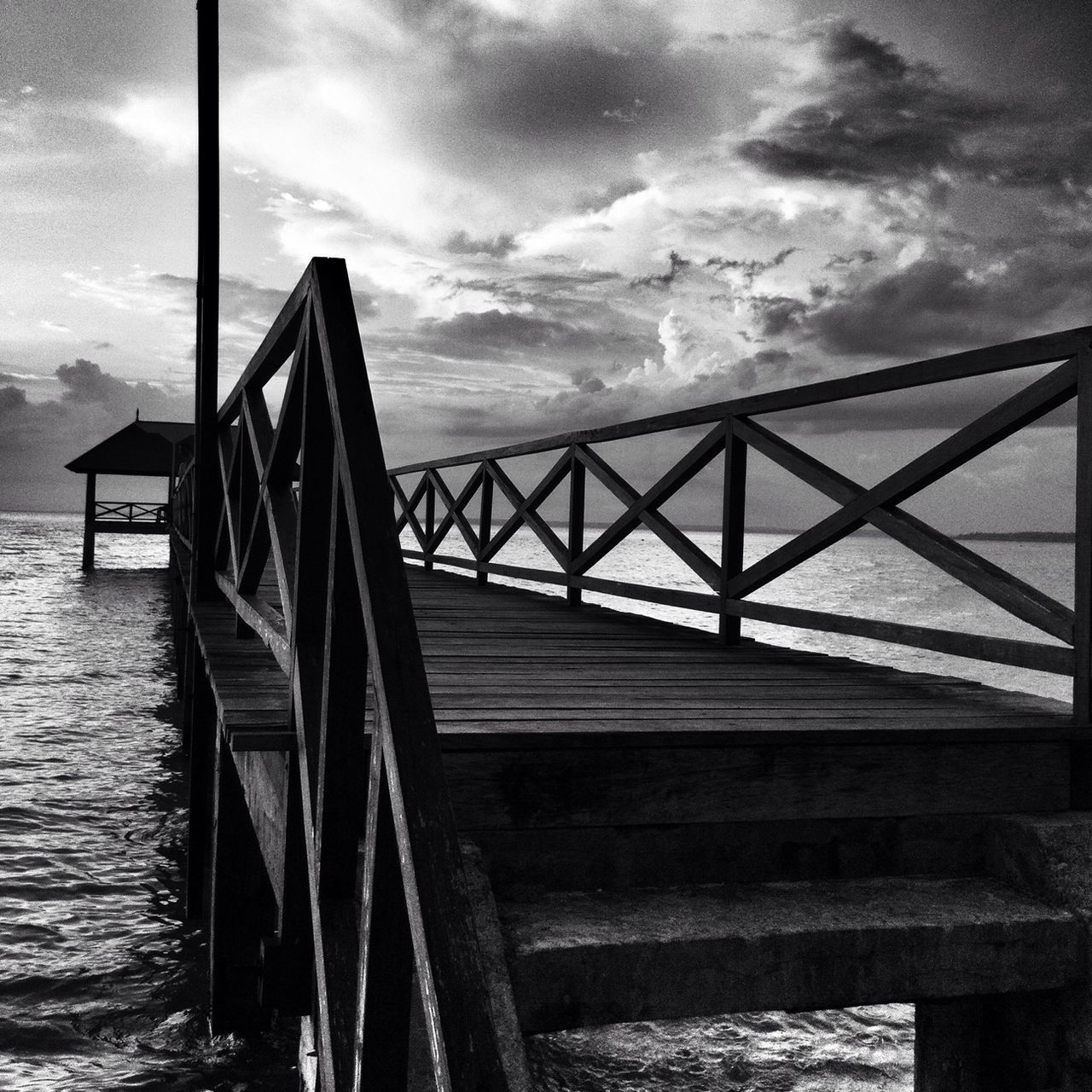 sky, cloud - sky, built structure, wood - material, railing, architecture, cloudy, pier, cloud, water, sea, wooden, wood, tranquility, nature, day, outdoors, weather, no people, tranquil scene