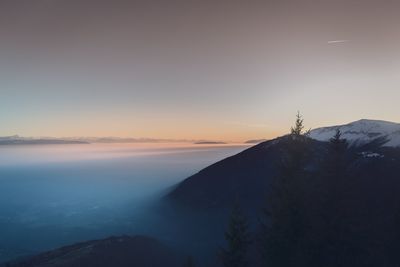 Scenic view of mountains against sky during sunset