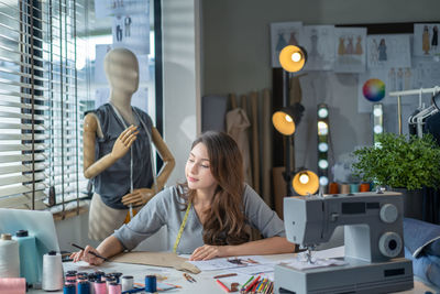 Young woman working at home