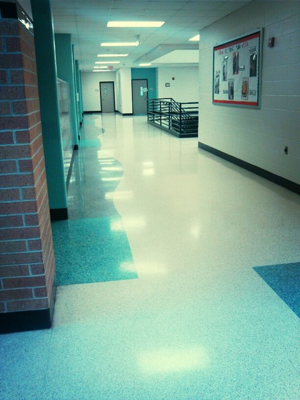 indoors, illuminated, architecture, built structure, empty, the way forward, absence, ceiling, modern, corridor, flooring, lighting equipment, reflection, tiled floor, wall - building feature, diminishing perspective, no people, building, interior, tile