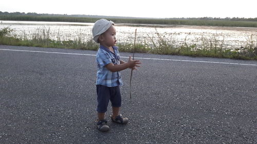 Boy standing on road