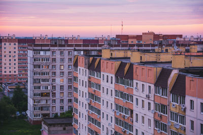 High angle view of buildings against sky during sunset