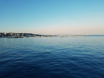 Scenic view of sea against clear blue sky