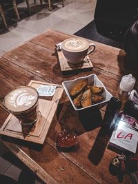 High angle view of coffee cups on table