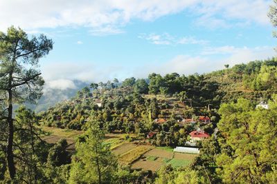 Scenic view of landscape against cloudy sky