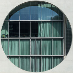 Building reflecting in water