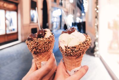 Midsection of woman holding ice cream