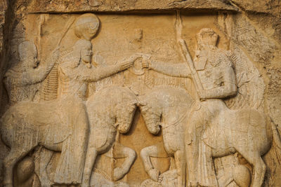Close-up of cross sculpture in temple